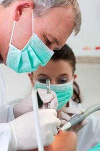 Dentist and Assistant Working